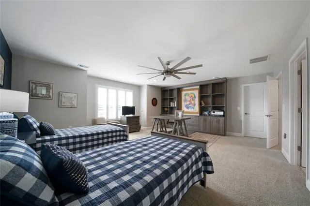 a bedroom with double bed and a large window