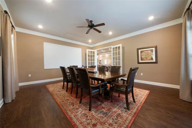 a living room with kitchen island furniture and a wooden floor