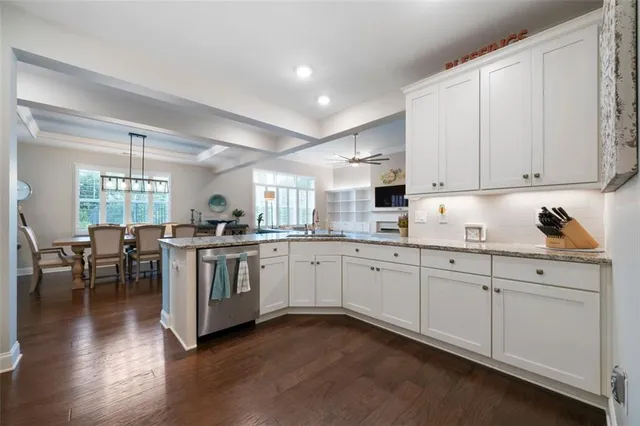 a kitchen with sink and cabinets