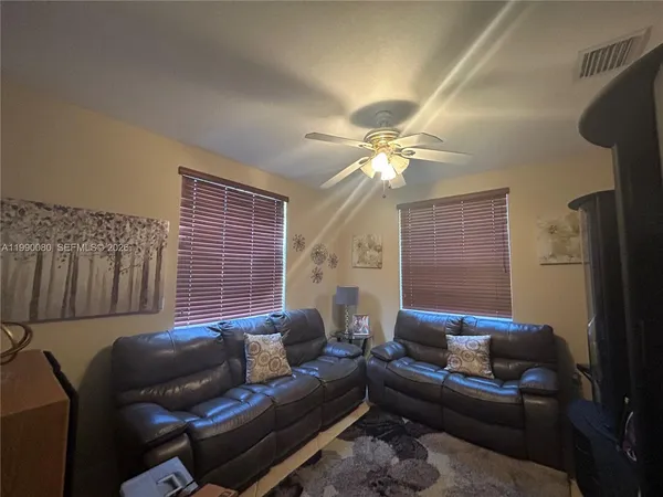 a living room with furniture and a window