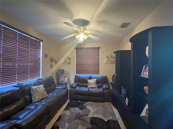 a living room with furniture and a window