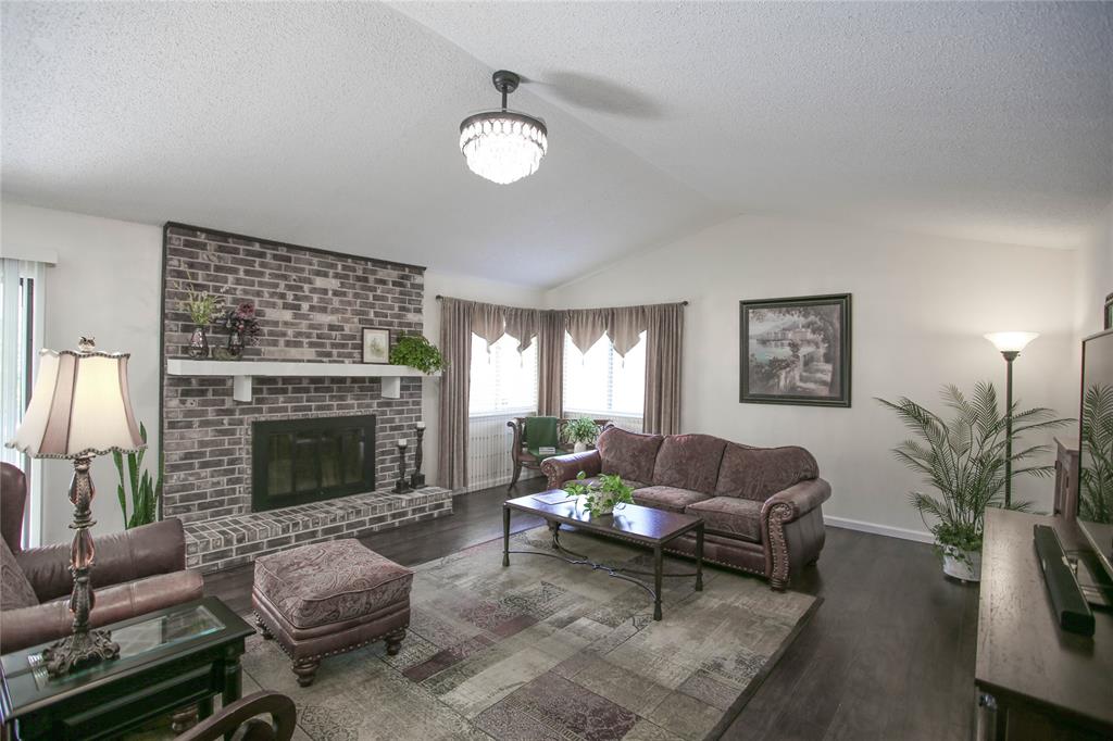 1720 Crystal Way Plano, TX 75074 - Photo 5 of 32 a living room with furniture and a fireplace