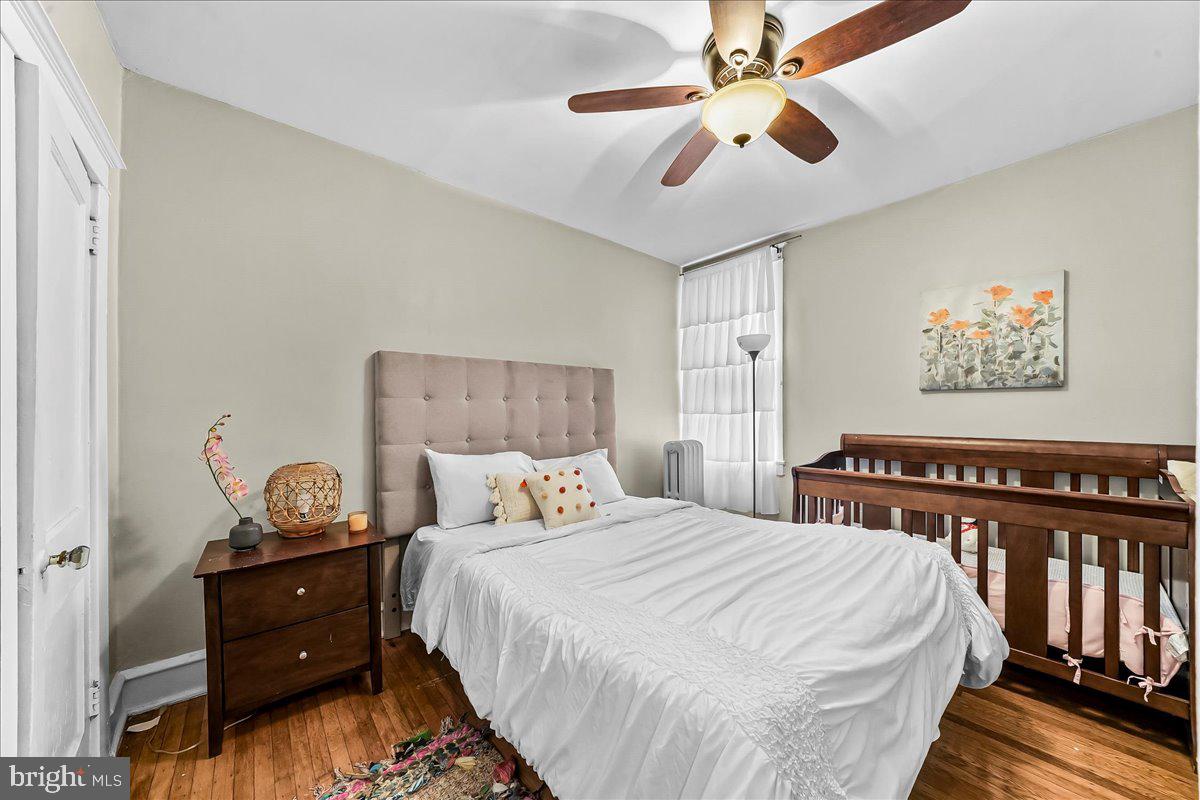 5348 West Berks Street Philadelphia, PA 19131 - Photo 11 of 18 a bedroom with a bed and a chandelier