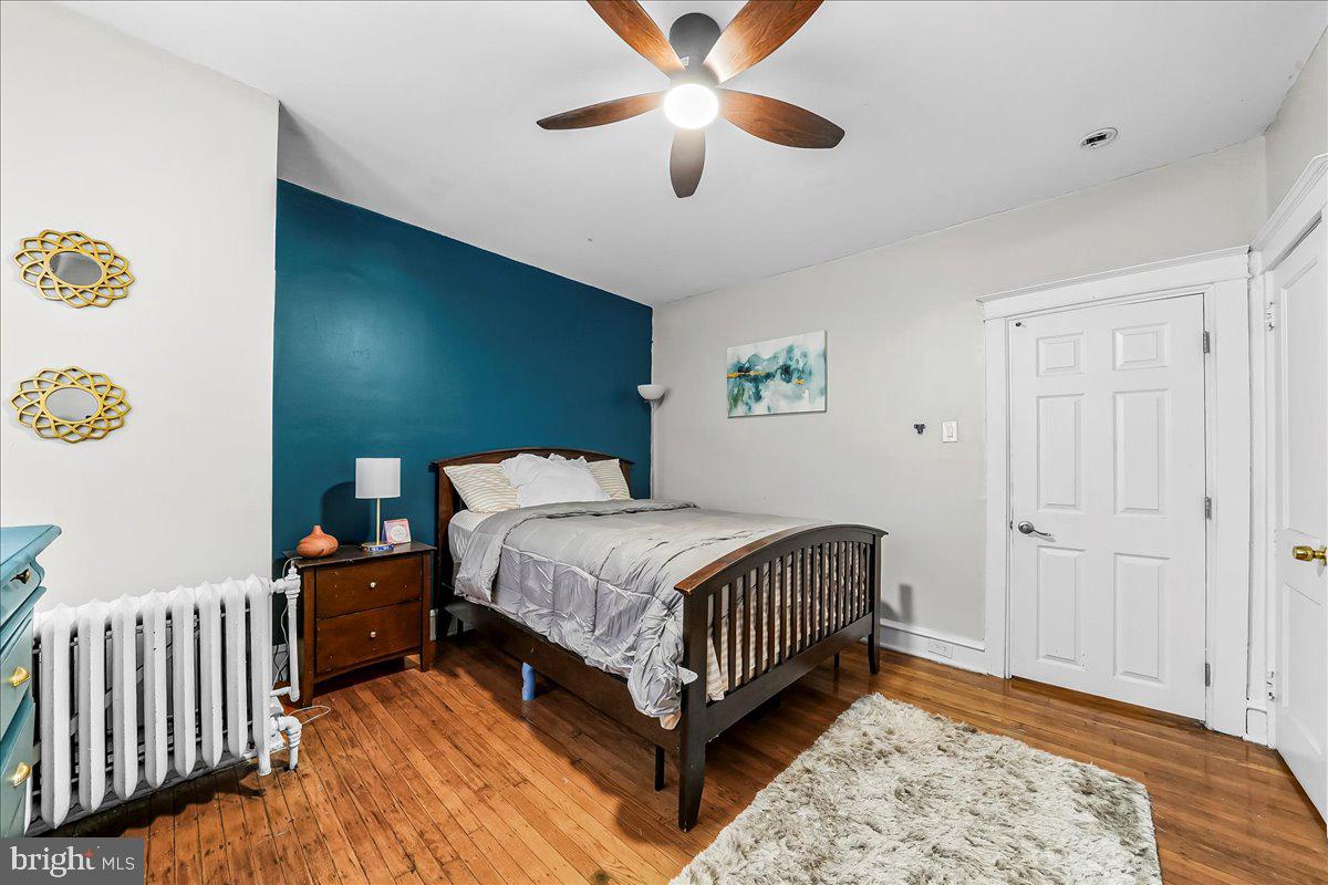 5348 West Berks Street Philadelphia, PA 19131 - Photo 13 of 18 a bedroom with a bed and a ceiling fan