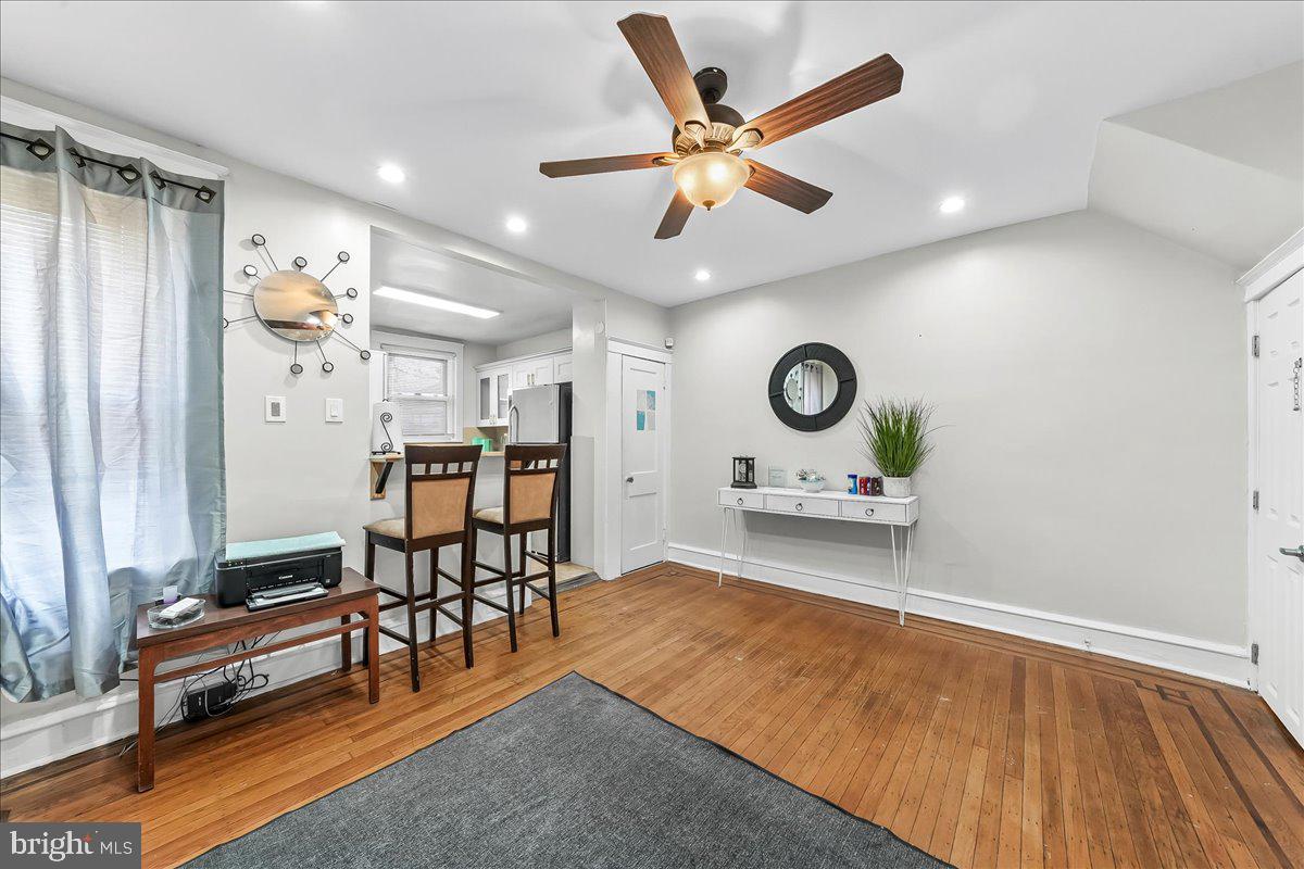 5348 West Berks Street Philadelphia, PA 19131 - Photo 7 of 18 a living room with furniture and a chandelier