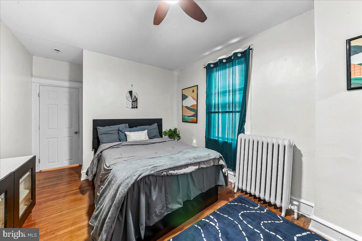 5348 West Berks Street Philadelphia, PA 19131 - Photo 10 of 18 a bedroom with a bed and wooden floor