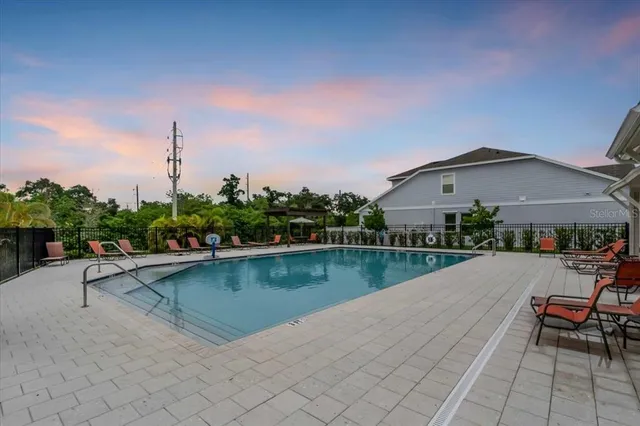 an outdoor space with lounge chair