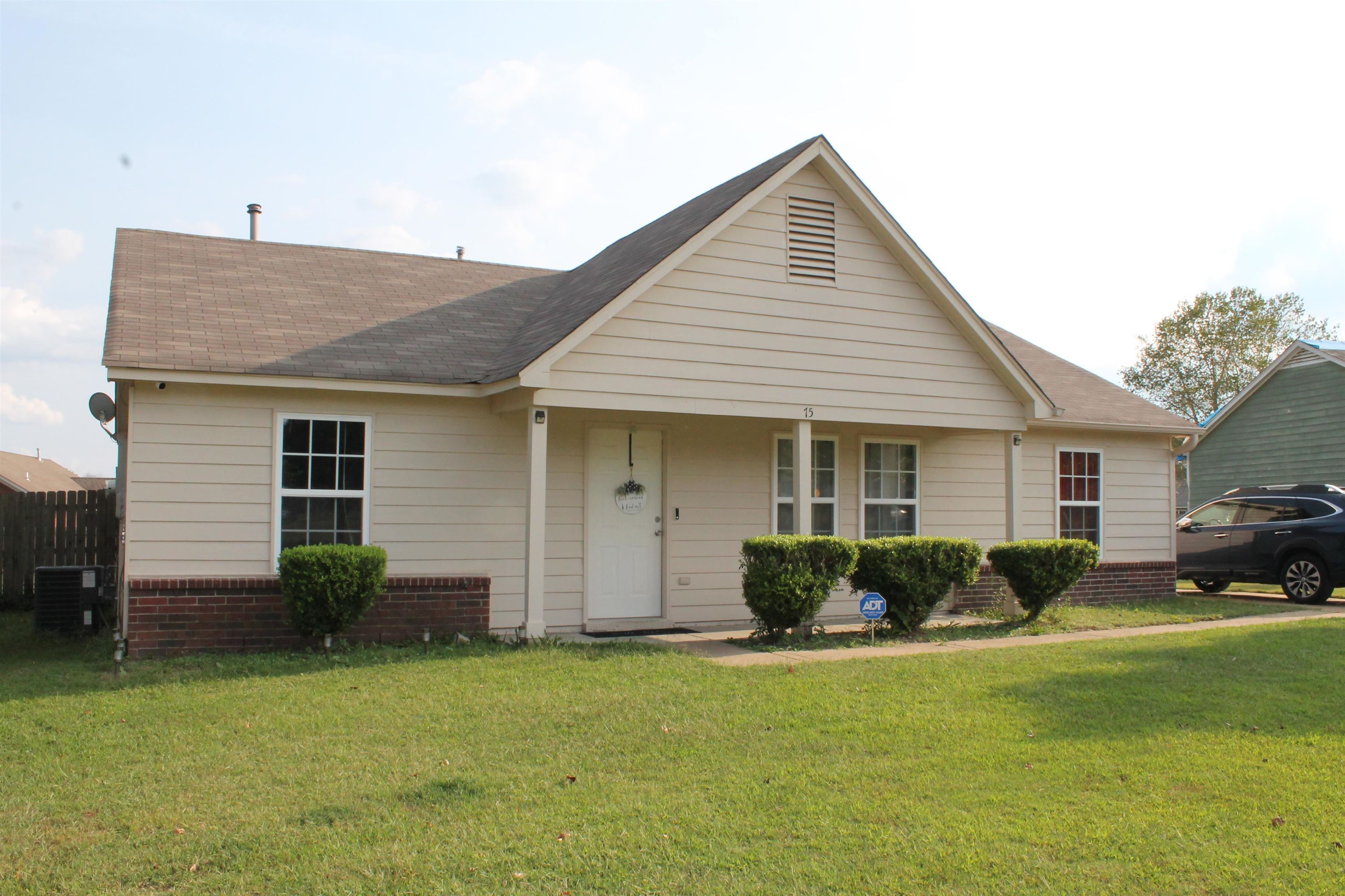 75 Springview Street Mason, TN 38049 - Photo 1 of 14 View of front facade featuring a front lawn and cooling unit