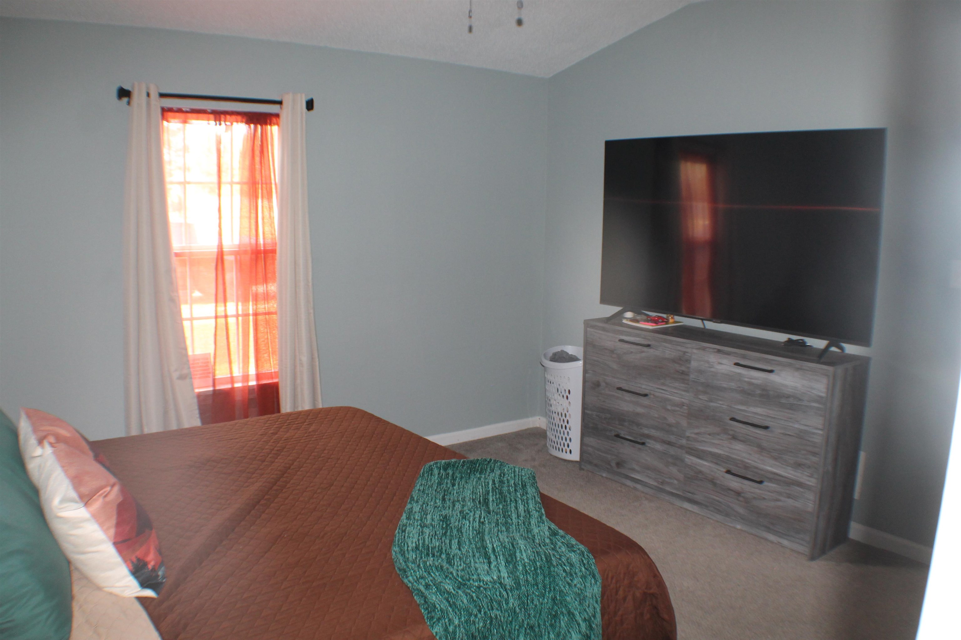 75 Springview Street Mason, TN 38049 - Photo 8 of 14 Carpeted bedroom with vaulted ceiling