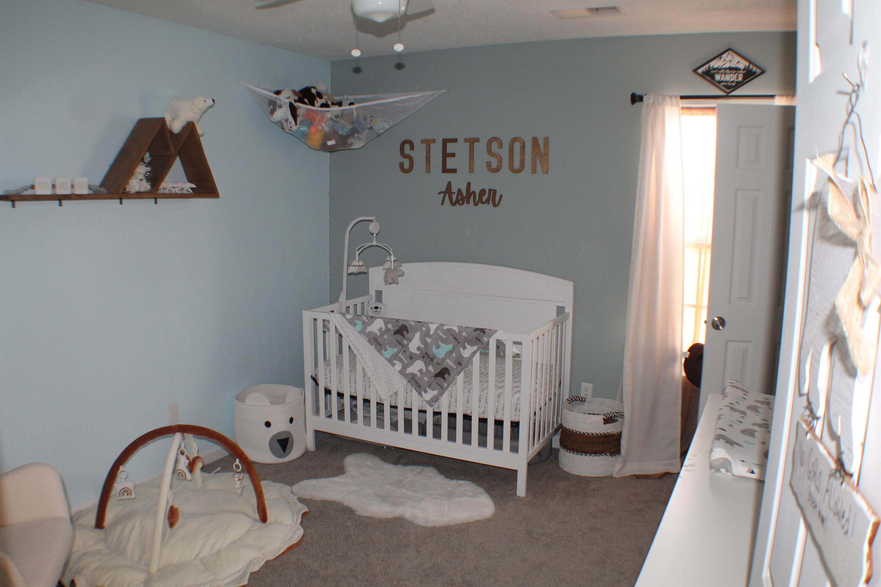 75 Springview Street Mason, TN 38049 - Photo 10 of 14 Bedroom with carpet flooring, ceiling fan, and a crib
