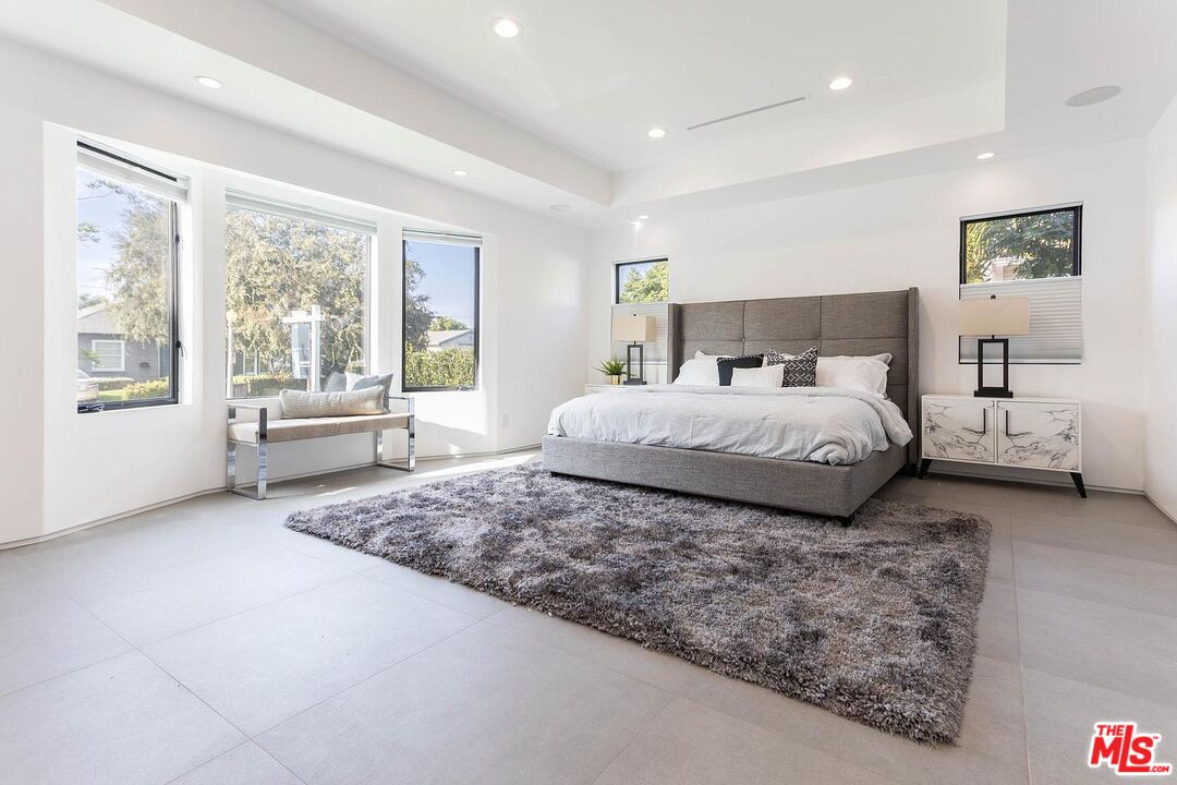 1948 South Point View Street Los Angeles, CA 90034 - Photo 13 of 27 a bedroom with a large bed and a large window
