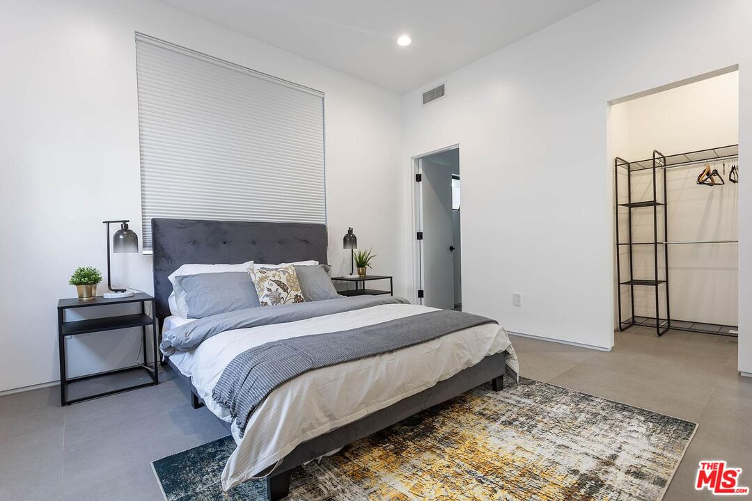 1948 South Point View Street Los Angeles, CA 90034 - Photo 18 of 27 a bedroom with a bed and a couch