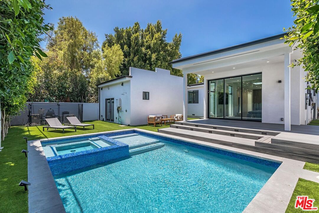 1948 South Point View Street Los Angeles, CA 90034 - Photo 2 of 27 a view of a house with swimming pool and sitting area