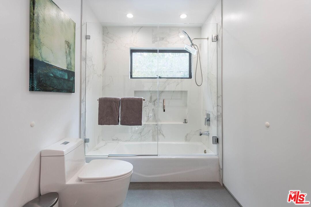 1948 South Point View Street Los Angeles, CA 90034 - Photo 22 of 27 a bathroom with a toilet a sink and bathtub