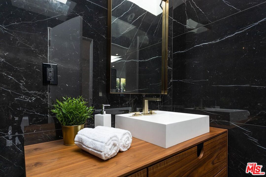 1948 South Point View Street Los Angeles, CA 90034 - Photo 24 of 27 a view of bathroom with a sink and mirror