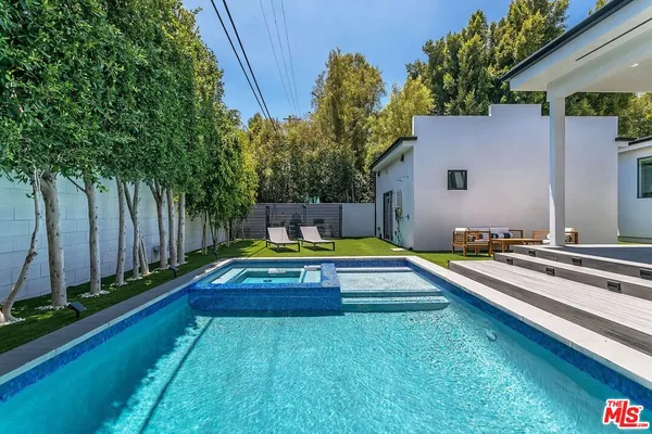 a view of swimming pool with a yard