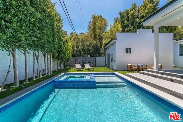 a view of swimming pool with a yard
