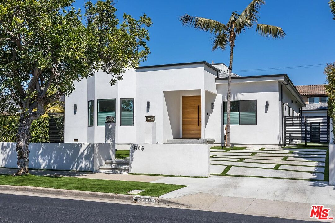 1948 South Point View Street Los Angeles, CA 90034 - Photo 6 of 27 a front view of a house with garden and plants