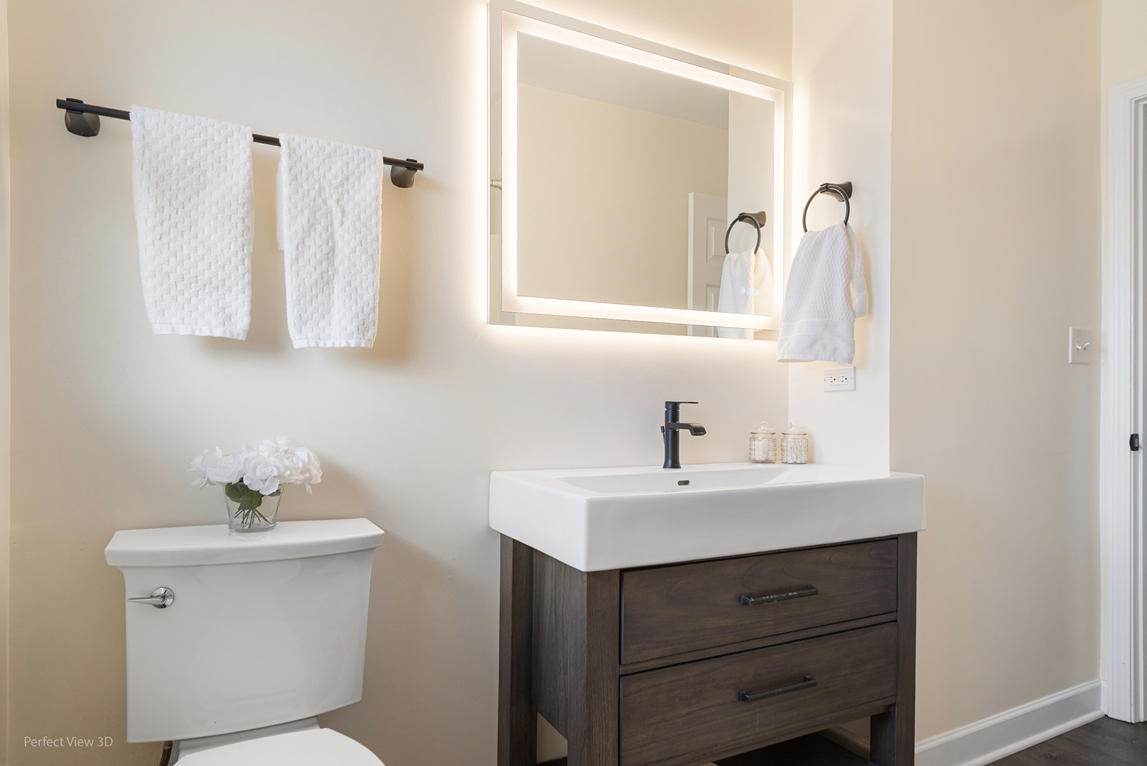 11N958 Almora Terrace Elgin, IL 60124 - Photo 12 of 26 a bathroom with a sink toilet and mirror