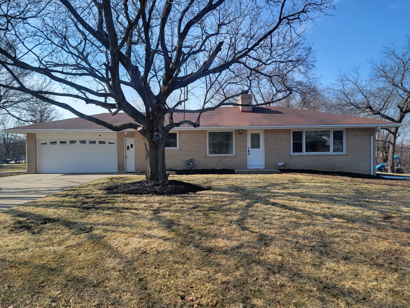 11N958 Almora Terrace Elgin, IL 60124 - Photo 26 of 26 a house with trees in front of it