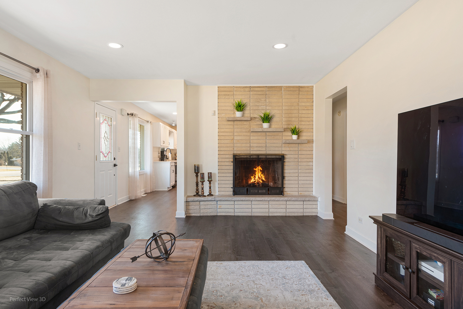 11N958 Almora Terrace Elgin, IL 60124 - Photo 5 of 26 a living room with furniture and a fireplace