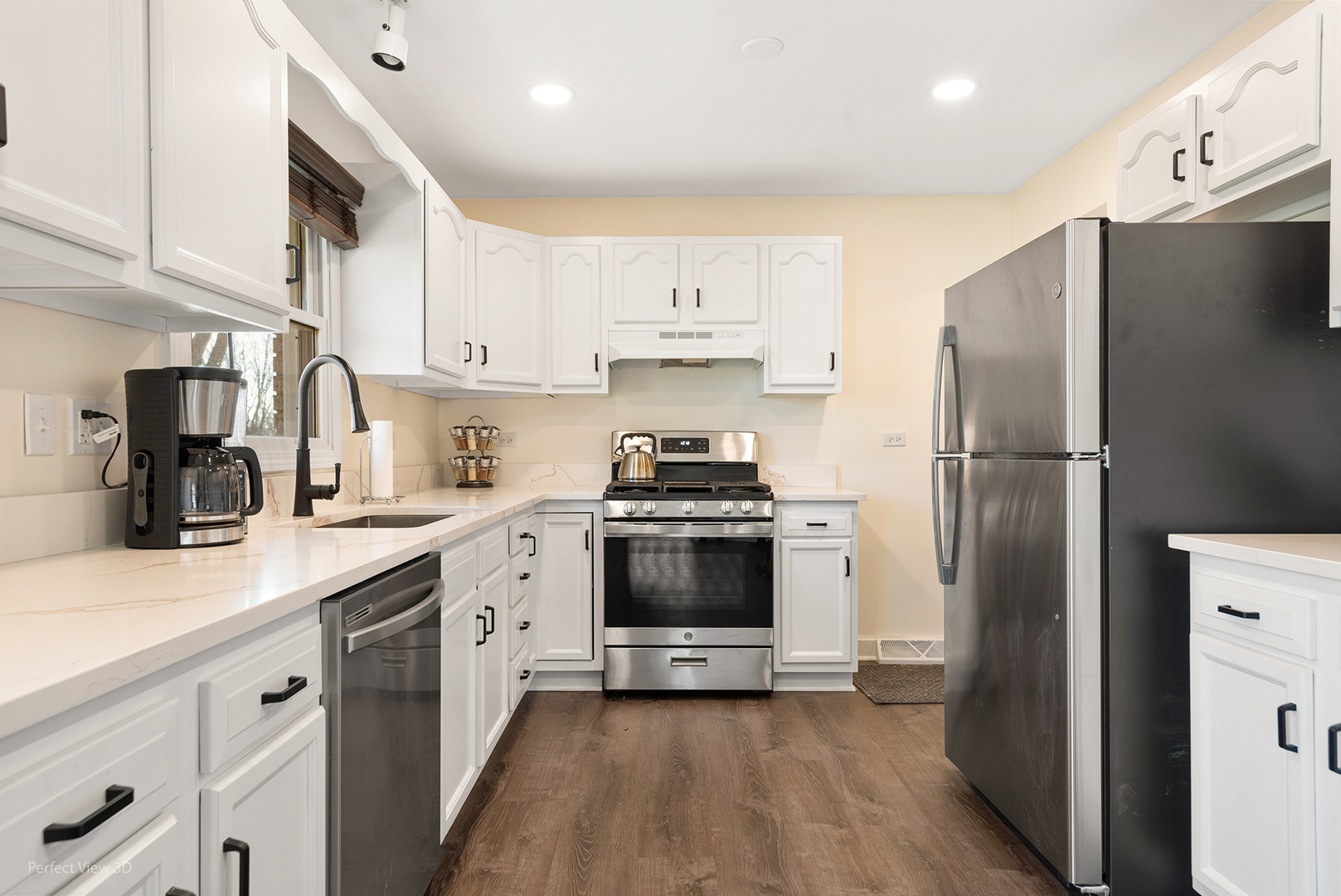 11N958 Almora Terrace Elgin, IL 60124 - Photo 6 of 26 a kitchen with stainless steel appliances a refrigerator sink and cabinets