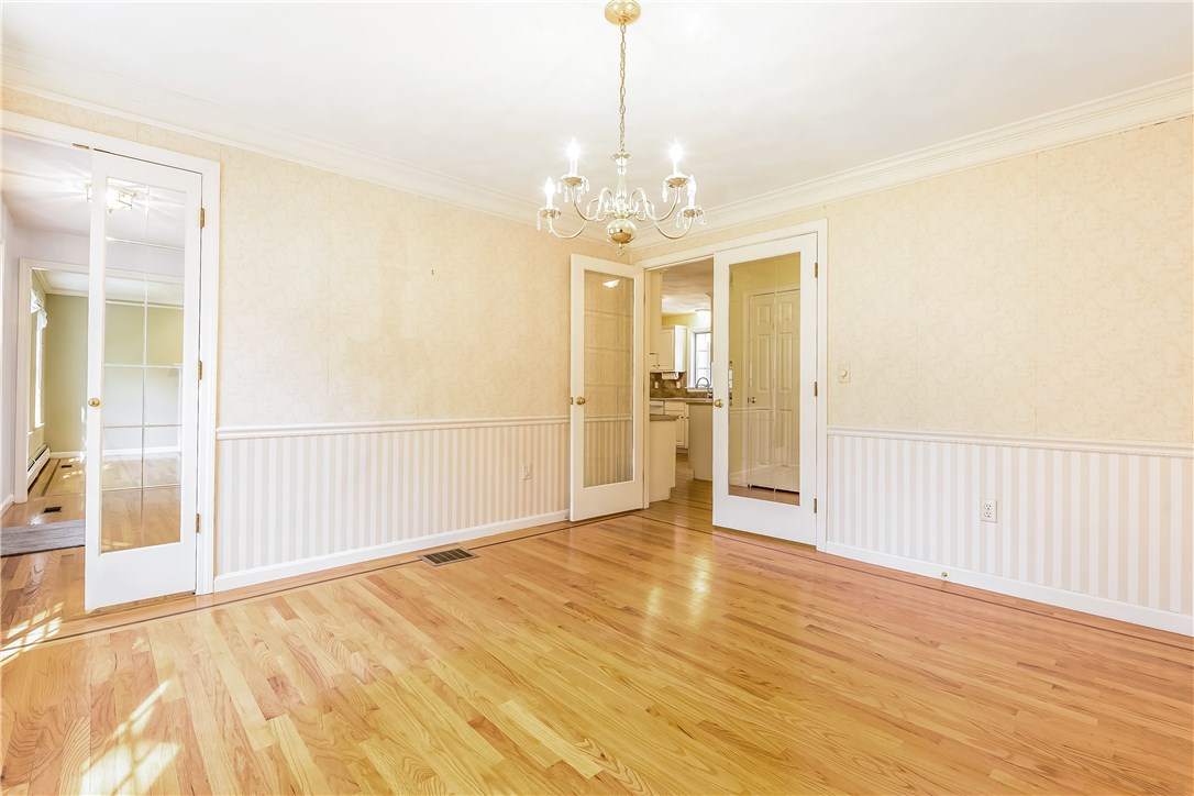 185 Wickham Road North Kingstown, RI 02852 - Photo 14 of 38 Formal dining room with french doors and crown molding!