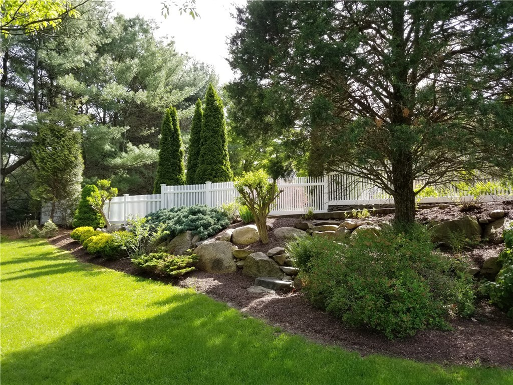 185 Wickham Road North Kingstown, RI 02852 - Photo 31 of 38 Natural stone stairs lead into back yard from patio area!