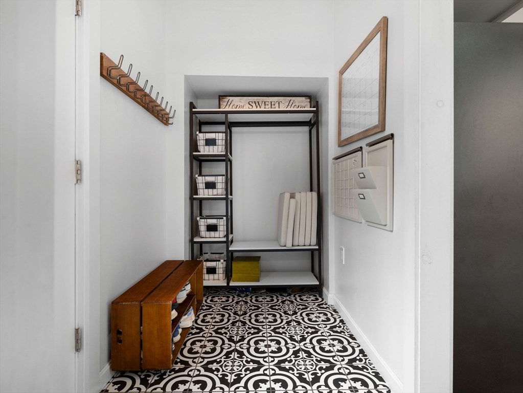 299 Central Avenue Dedham, MA 02026 - Photo 17 of 39 a walk in closet with wooden floor