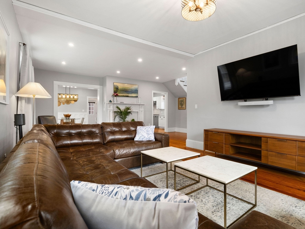 299 Central Avenue Dedham, MA 02026 - Photo 10 of 39 a living room with furniture and a flat screen tv