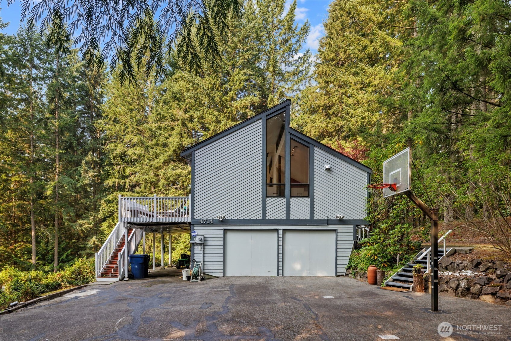 a yellow house with trees in front of it