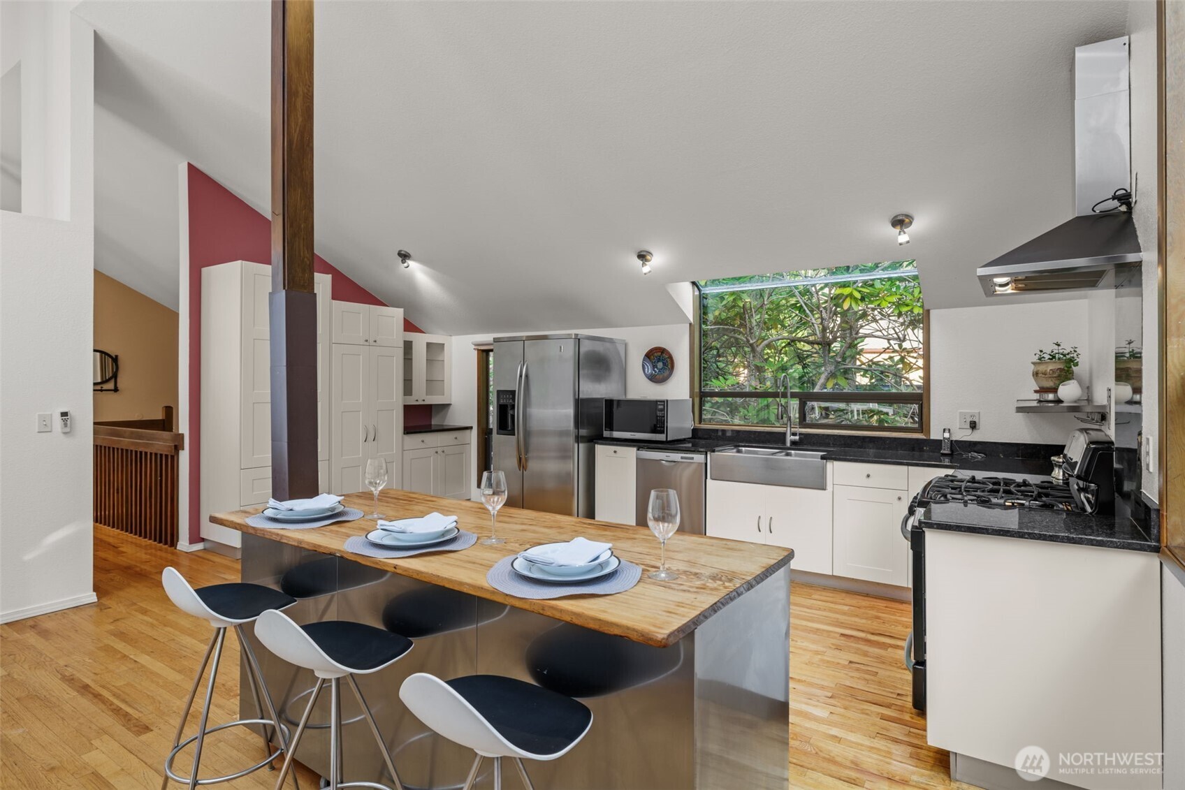 4714 175th Street Southeast Bothell, WA 98012 - Photo 17 of 40 a kitchen with a dining table and chairs