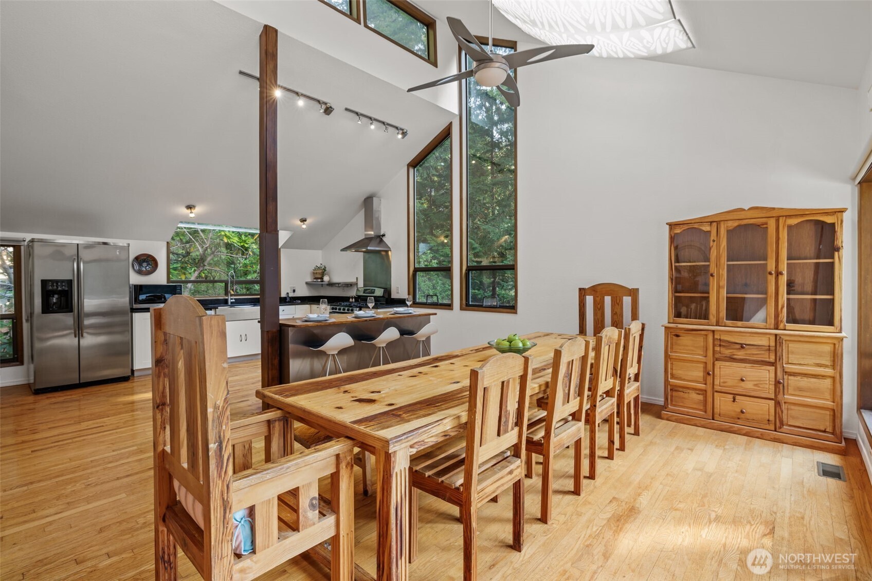 4714 175th Street Southeast Bothell, WA 98012 - Photo 20 of 40 a view of a dining room with furniture window and wooden floor