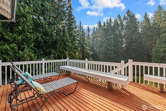 a view of a wooden deck with a bench