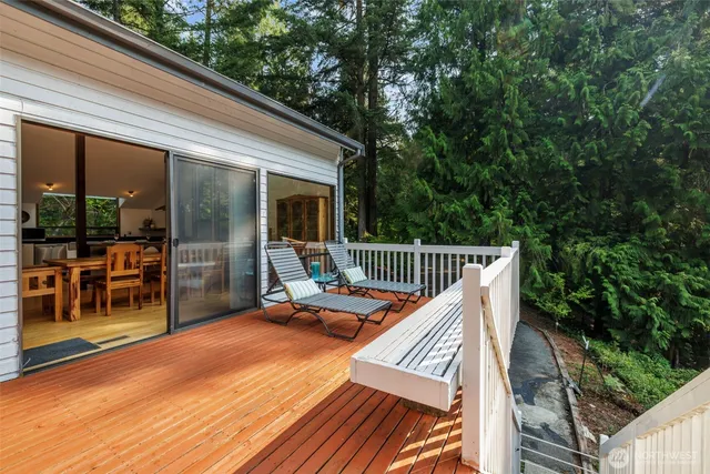 a balcony with trees in front of it