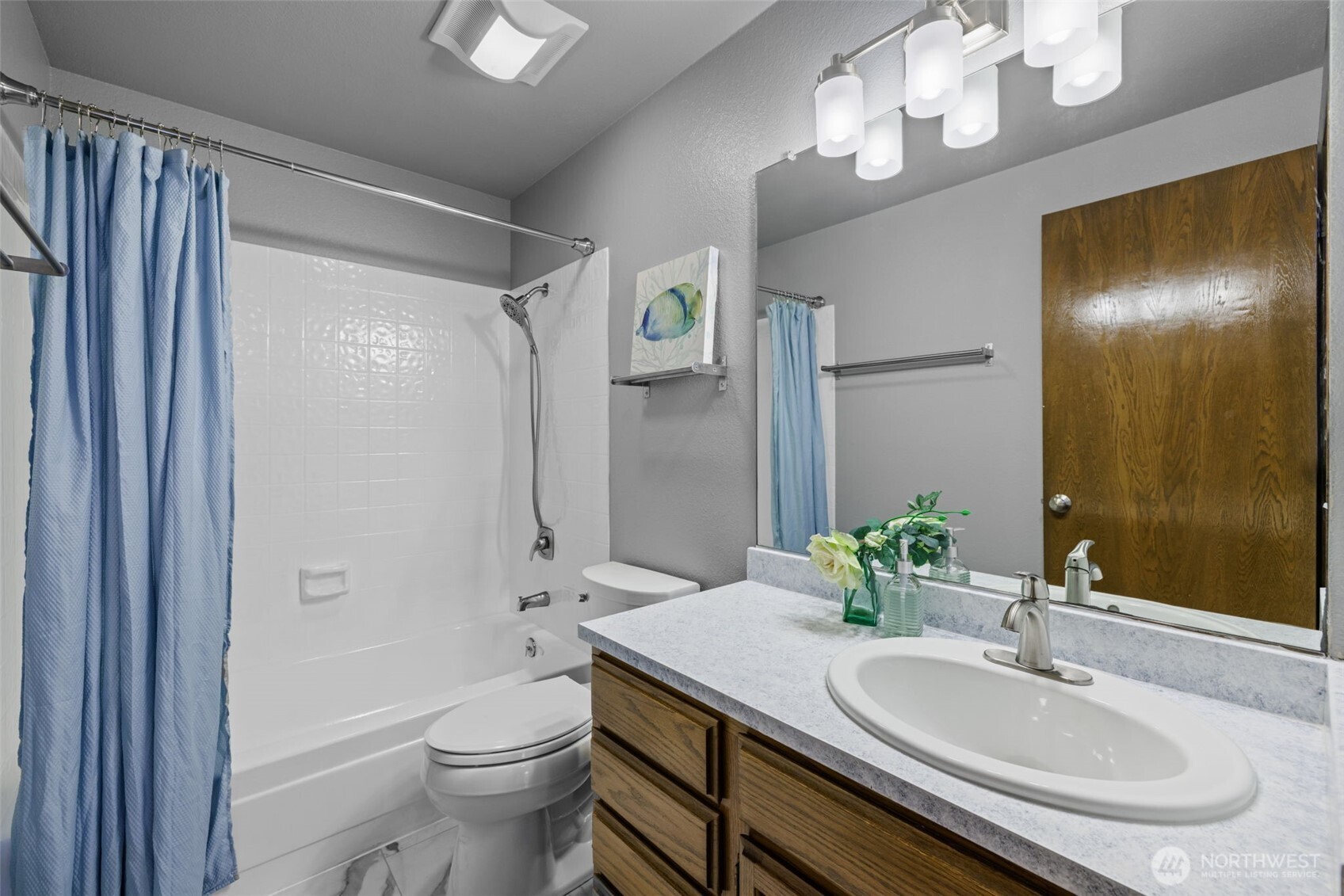 4714 175th Street Southeast Bothell, WA 98012 - Photo 29 of 40 a bathroom with a granite countertop sink a toilet and shower