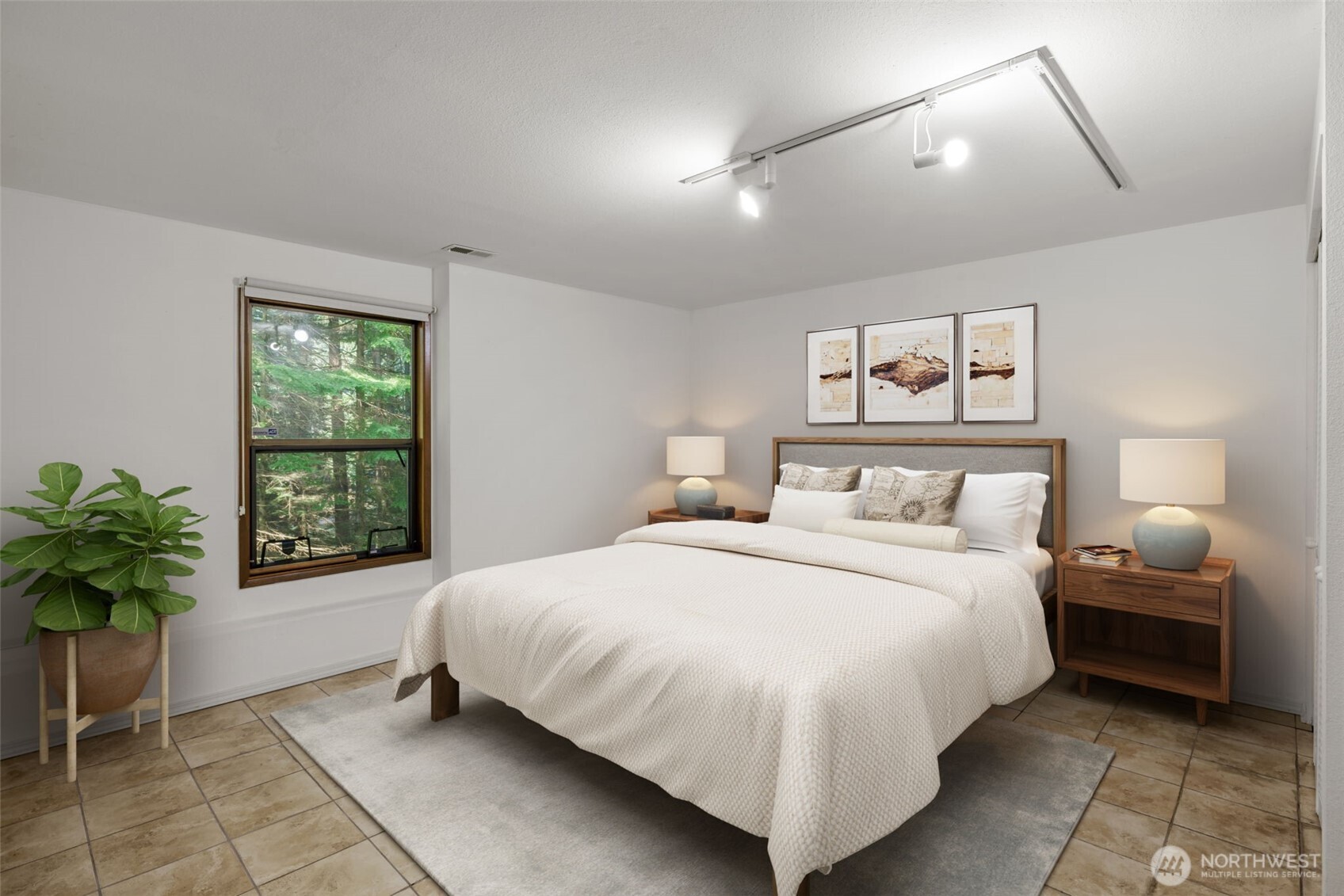 4714 175th Street Southeast Bothell, WA 98012 - Photo 35 of 40 a bedroom with a large bed and a potted plant