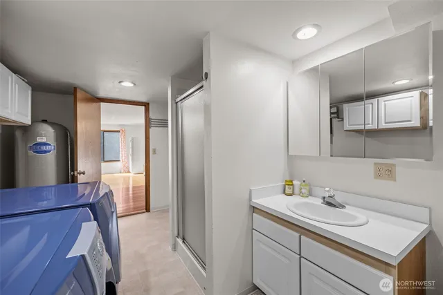 a kitchen with a sink and a refrigerator