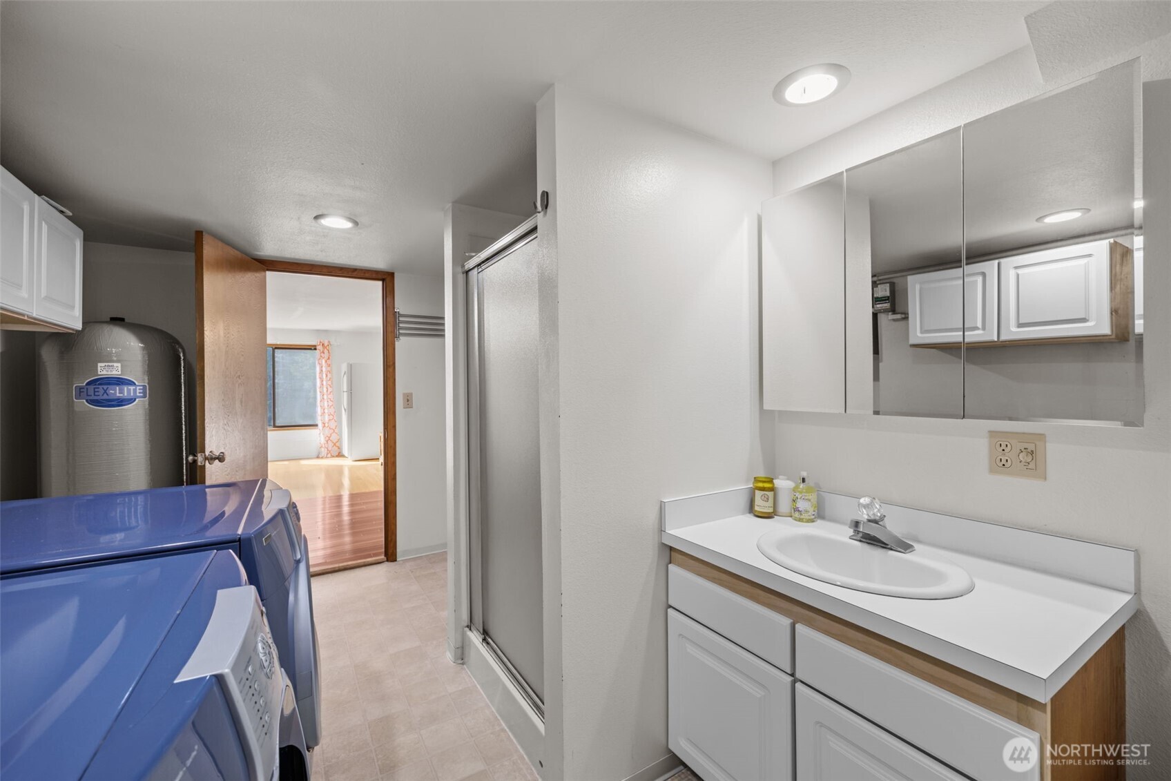 4714 175th Street Southeast Bothell, WA 98012 - Photo 36 of 40 a kitchen with a sink and a refrigerator