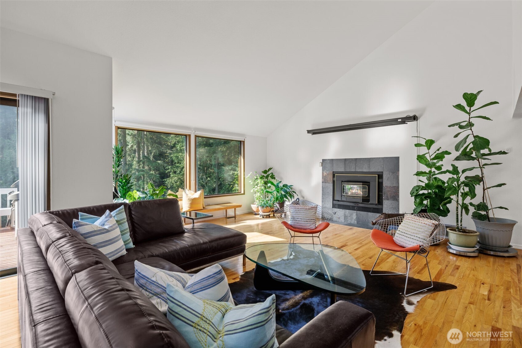 4714 175th Street Southeast Bothell, WA 98012 - Photo 8 of 40 a living room with furniture and a fireplace