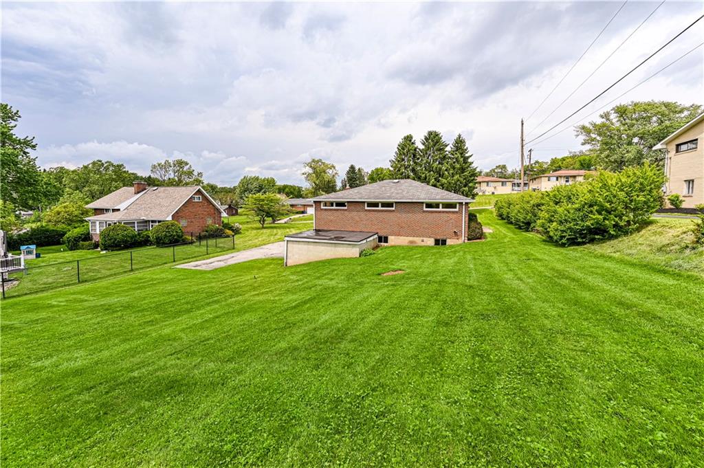 13740 Ridge Road Irwin, PA 15642 - Photo 39 of 43 a view of a house with a big yard and large trees