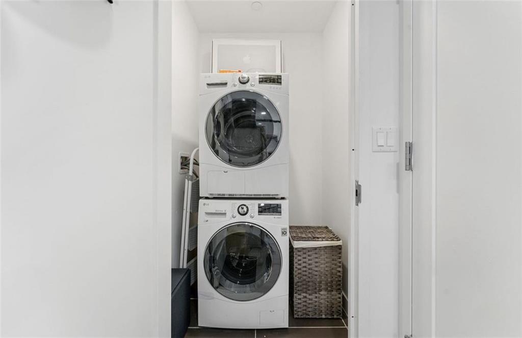 1238 63rd Street, Unit 326 Brooklyn, NY 11219 - Photo 5 of 5 a utility room with dryer and washer