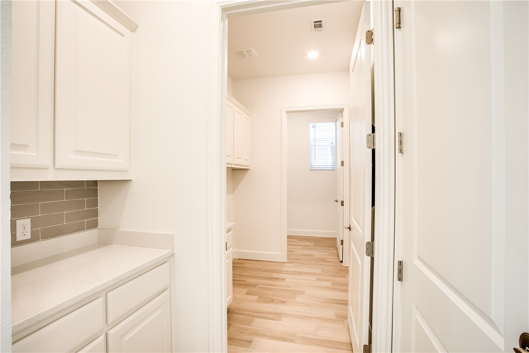 505 Affazia Lane Georgetown, TX 78628 - Photo 27 of 32 a bathroom with a sink and a mirror