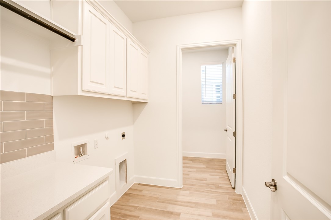 505 Affazia Lane Georgetown, TX 78628 - Photo 28 of 32 a bathroom with a bathtub and shower