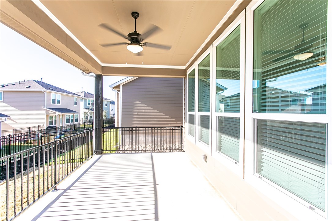 505 Affazia Lane Georgetown, TX 78628 - Photo 29 of 32 a view of a balcony with a ceiling fan
