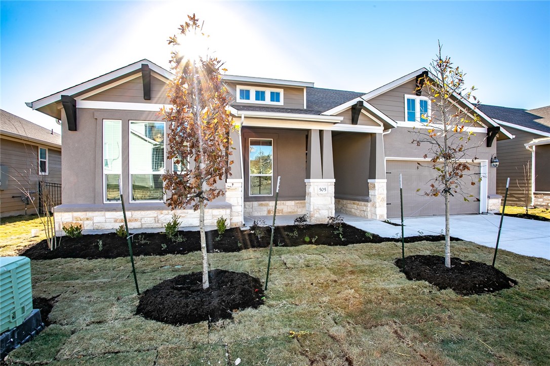 505 Affazia Lane Georgetown, TX 78628 - Photo 3 of 32 a front view of a house with garden