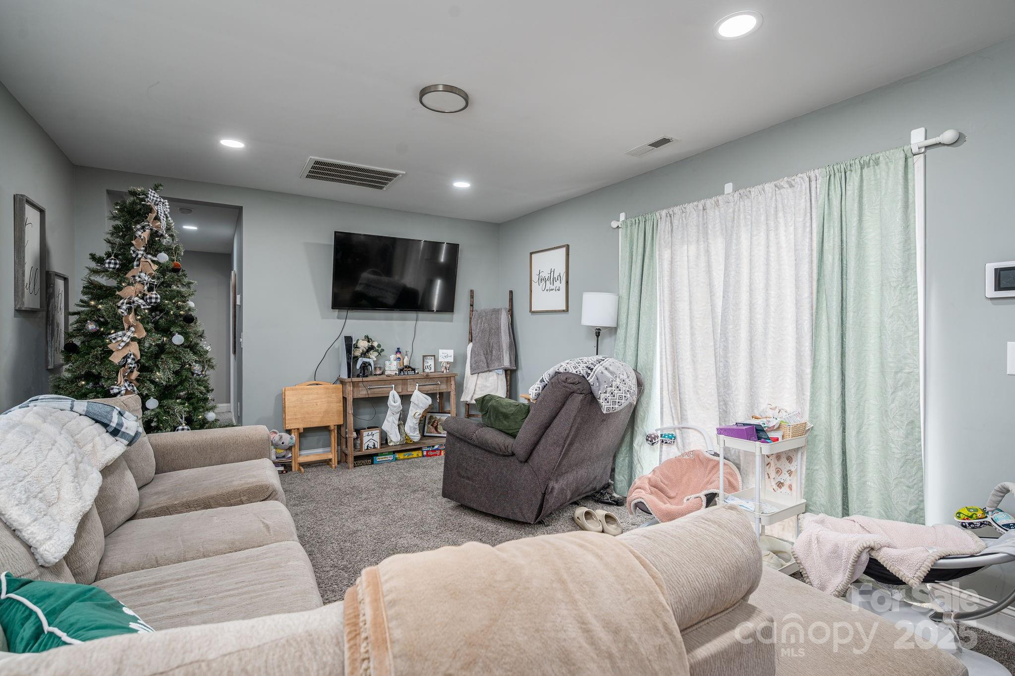 102 Guffey Road Cherryville, NC 28021 - Photo 3 of 15 a living room with furniture window and a flat screen tv