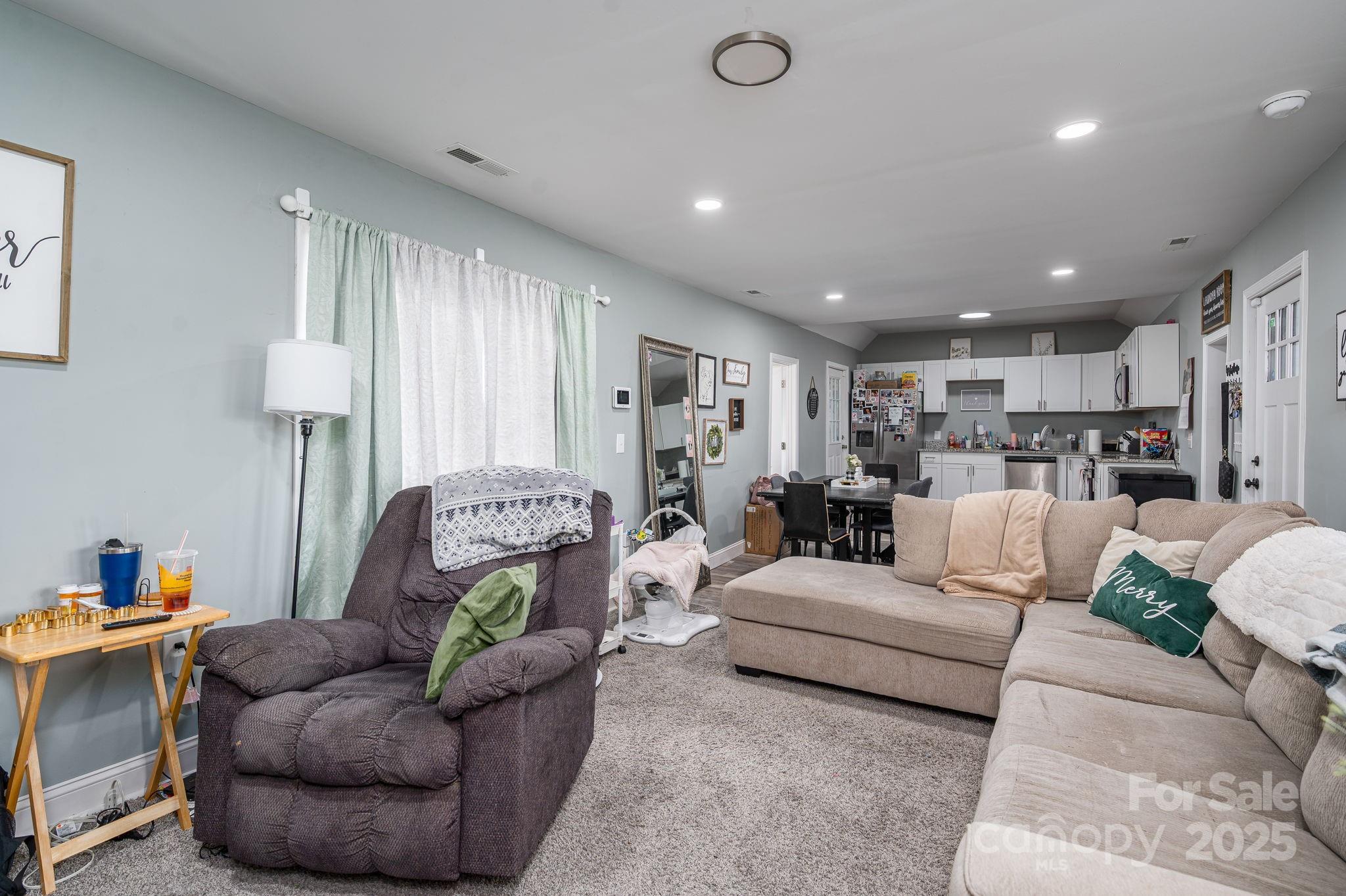 102 Guffey Road Cherryville, NC 28021 - Photo 4 of 15 a living room with furniture and a chandelier