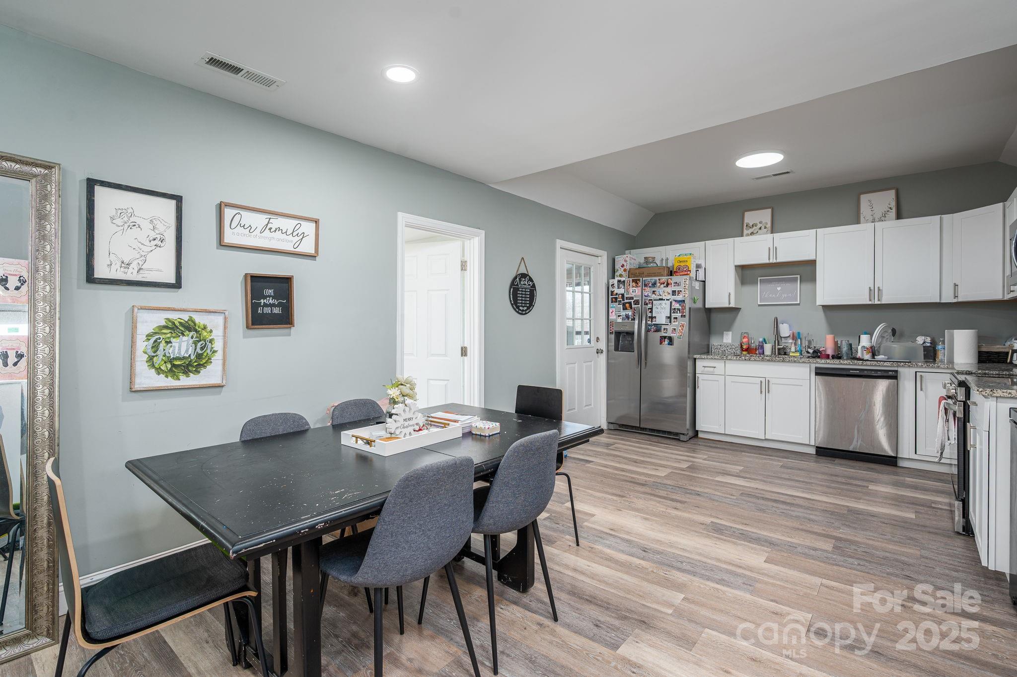 102 Guffey Road Cherryville, NC 28021 - Photo 5 of 15 a view of a dining room with furniture and wooden floor