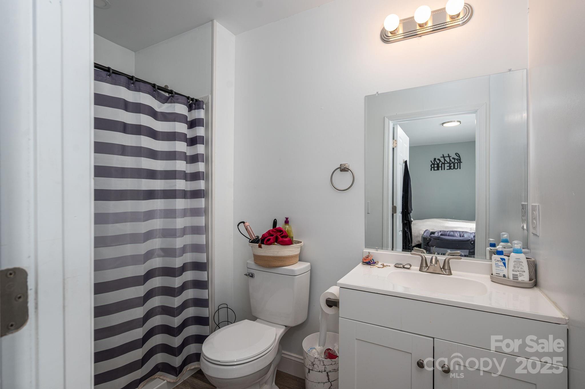 102 Guffey Road Cherryville, NC 28021 - Photo 7 of 15 a bathroom with a sink toilet vanity and shower